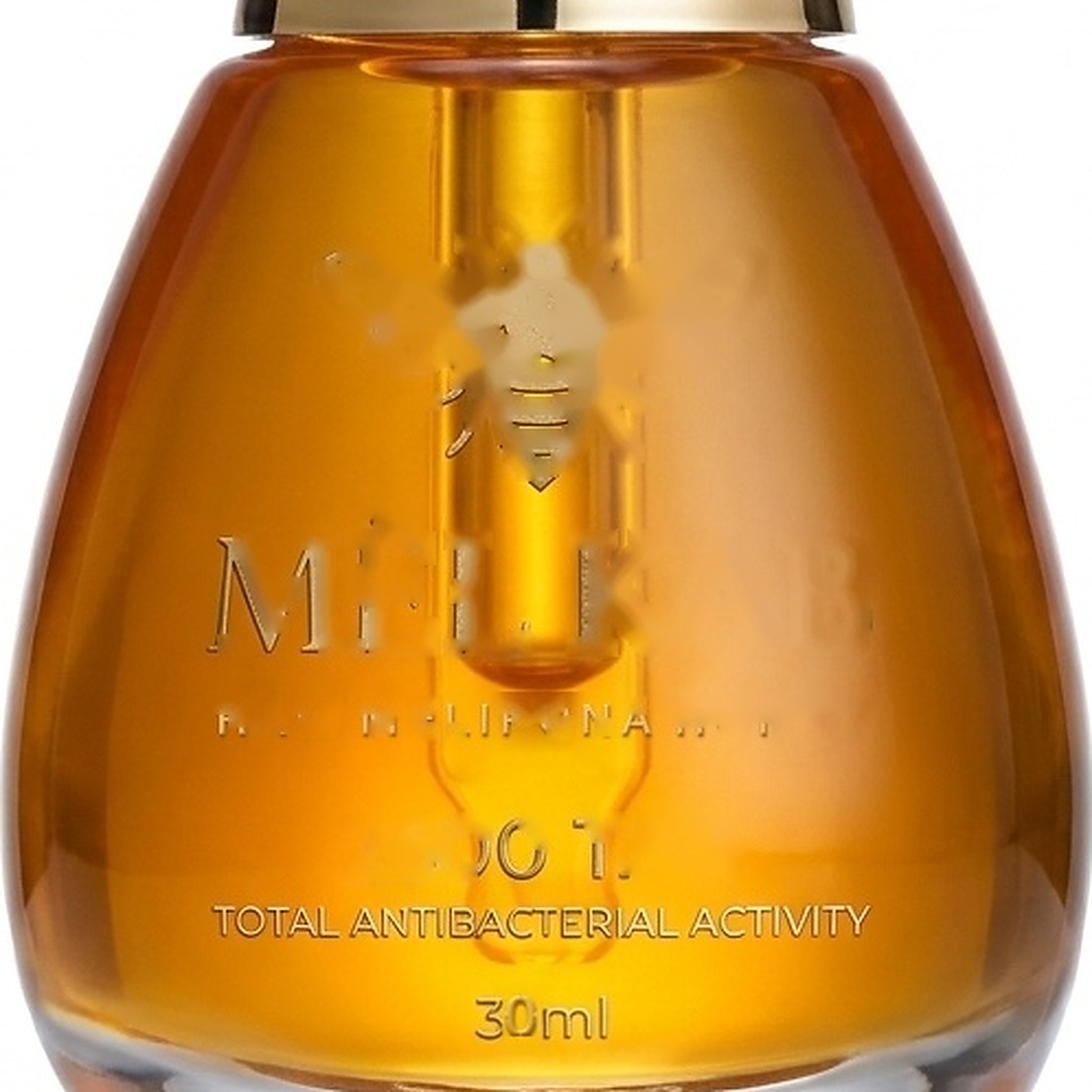 Zoomed MËL KAB Teardrop Glass Bottle and Raw Honey